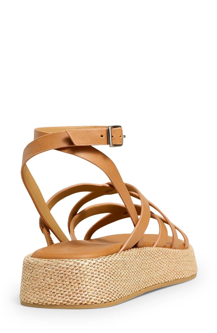 Woven trim highlights the earthy platform sole of this strappy, vacation-ready sandal. Adjustable ankle strap with buckle closure; hidden elastic inset Leather upper and lining/rubber and synthetic sole Imported Closed Toe Footbed Sandals With Adjustable Strap For Vacation, Summer Platform Footbed Sandals With Ankle Strap, Leather Wedge Heel Sandals For Beach Season, Summer Sandals With Ankle Strap, Adjustable Double Strap Wedge Sandals For Beach, Spring Ankle Strap Platform Footbed Sandals, Vacation T-strap Sandals With Woven Sole And Open Toe, Vacation T-strap Sandals With Woven Sole, Ankle Strap Sandals In Natural Color For Summer