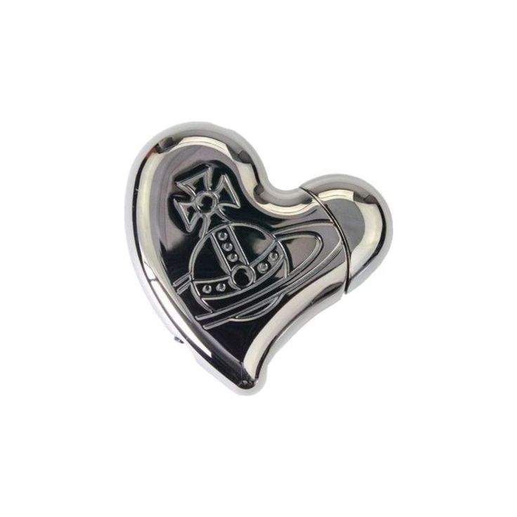 a black and silver heart shaped pin with an image of a boat on it's side