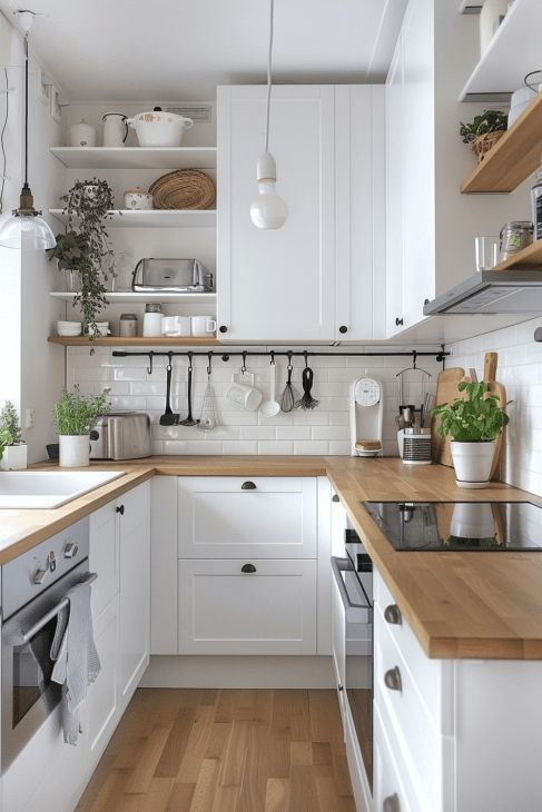 the kitchen is clean and ready for us to use it's counters are white