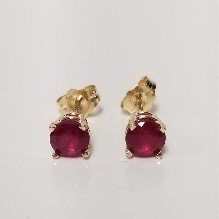 "Thanks for shopping our vintage estate store. We tend to sell well below wholesale and truly hope you enjoy all of our items. Many of the items are one of a kind, so please enjoy scrolling through the pictures and hopefully something will catch your eye. Brown spots are from camera or reflections. Nice estate 14k yellow gold natural ruby studs. Color is red testing natural and are stunning. Retails $989 on sale $289 Size: 5mm 1/4\" Weight: 1.04 grams Carat: .50ct per stud Nice studs, some that you will love, marked 14k and backs are included." Classic Birthstone Earrings For Formal Occasions, Classic Red Diamond Earrings As Gift, Classic Red Diamond Earrings For Gift, Classic Ruby Birthstone Earrings, Yellow Gold Round Earrings For Anniversary, Classic 14k Gold Diamond Earrings, Hallmarked, Classic Ruby Earrings For Formal Occasions, Classic Ruby Earrings In Yellow Gold, Classic Earrings For Anniversary