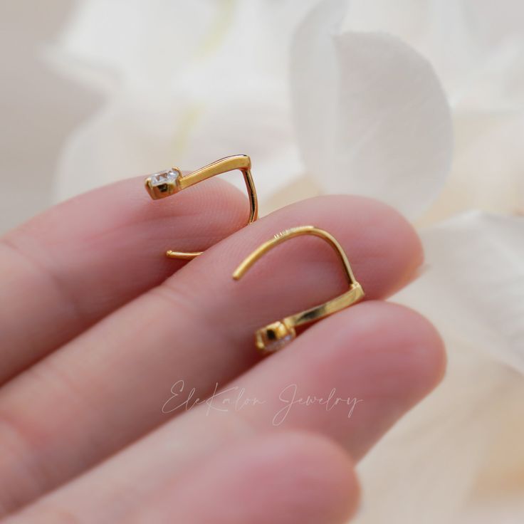 Simple and sleek line ear hook crafted in solid 10k yellow gold Made to Order Ship within 2-3 weeks - Earring size: 12mm in length - Sold as A Pair. - Made in 14 karat gold. - Stamp with 14K. Minimalist Yellow Gold Plated Ear Climbers, Modern 14k Yellow Gold Ear Climbers, Gold 14k Ear Climbers For Everyday Wear, Gold 14k Everyday Ear Climbers, Gold Sterling Silver Ear Climbers With Ear Wire, Modern 14k Gold Ear Climbers As Gift, 14k Gold Everyday Ear Climbers, Gift Huggie Ear Climbers With Ear Wire, Yellow Gold Huggie Ear Climbers As Gift