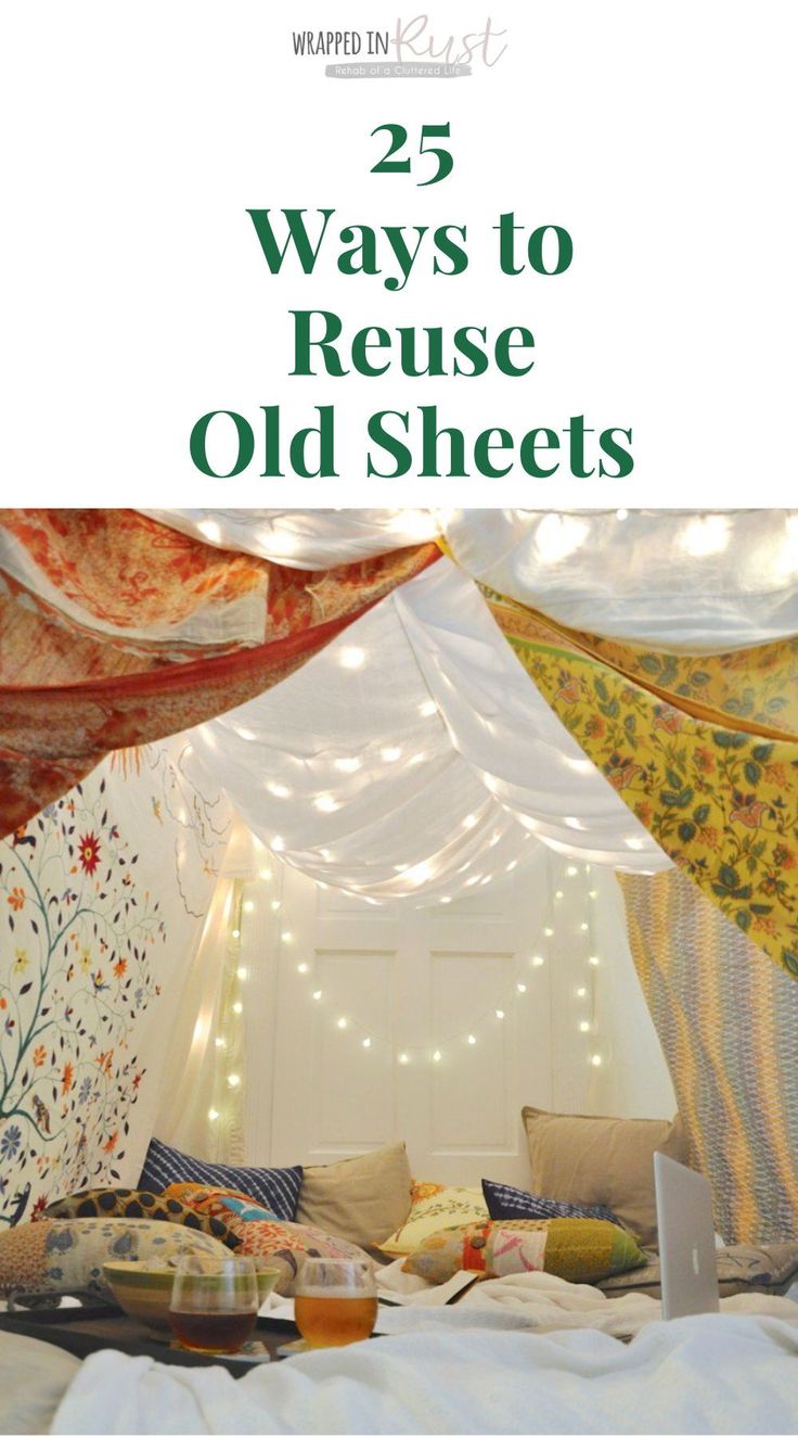 a bed covered in white sheets with lights on it and the words 25 ways to reuse old sheets