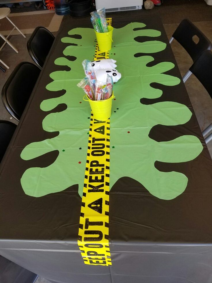 the table is decorated with yellow and green tape