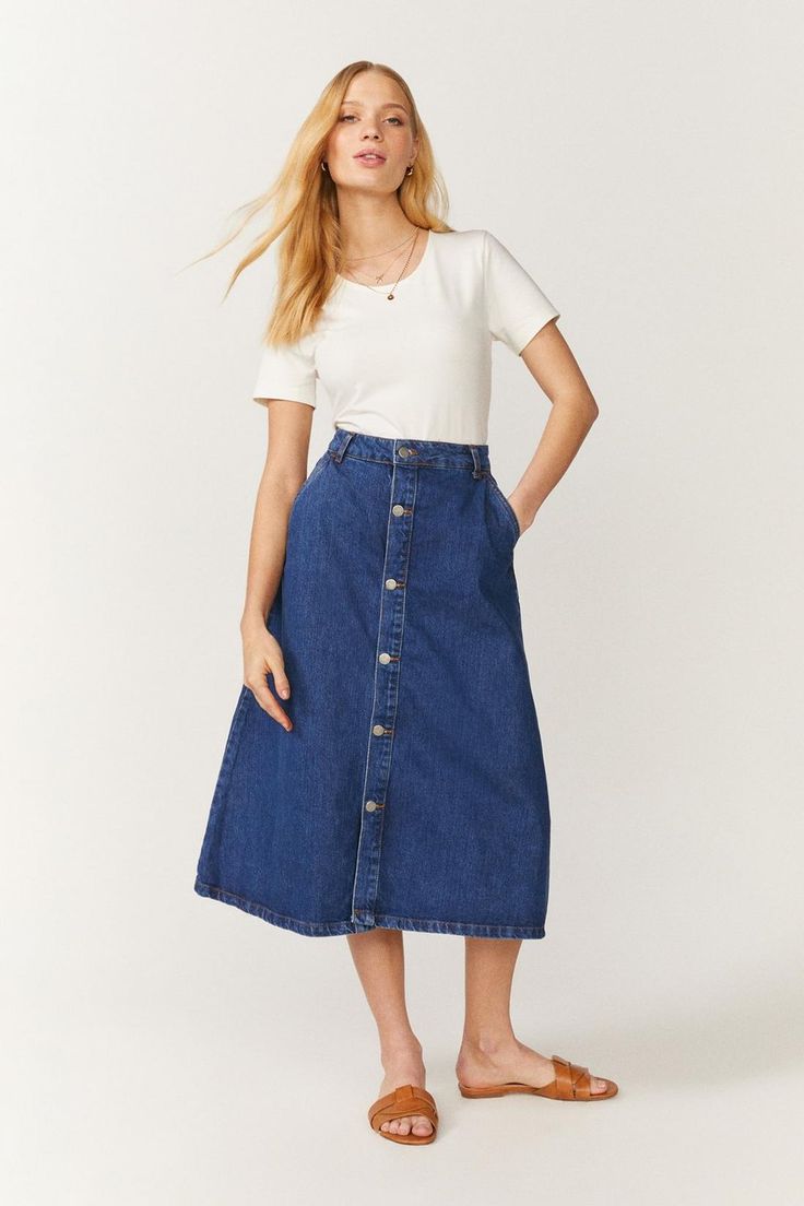 Forget your jeans - try a denim skirt instead! Proving it's just as versatile, this midi comes in a super-flattering A-line shape and stylish button-up detailing. A Line Jeans Skirt, Blue Midi Skirt Outfit Summer, Aline Denim Skirt, Aline Denim Skirt Outfits, Denim A Line Skirt Outfit, Modest Denim Skirt Outfit, Aline Skirt Outfit, Denim Skirt Styling, Denim Skirt Outfit Ideas