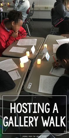 several students are sitting at desks with paper and candles in front of their faces