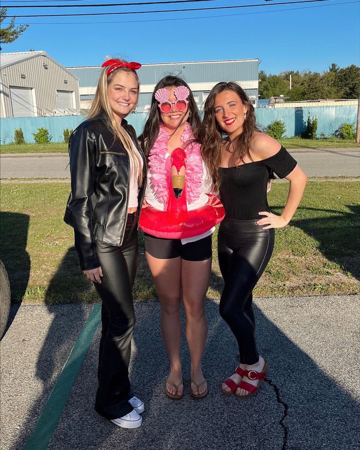 three women in costumes posing for the camera