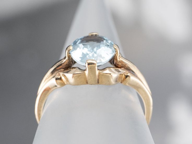 This stunning aquamarine has been set into this Retro era solitaire ring. The cool blue tones contrast beautifully with the warmth of the vintage mounting, while the tapered shoulders draw light into the sparkling gem. This is a lovely piece that is pretty enough to wear alone, yet versatile enough to stack with other rings!Metal: 10K Yellow GoldGem: Aquamarine 1.37 CaratsGem Measurements: 8.5 x 6.9 mm, OvalRing Size: 5.25Marks: "10K" Stamped on the inside band Aquamarine Gold Ring, Rings Metal, Retro Era, Blue Tones, Ring Ring, Metal Rings, Solitaire Ring, Aquamarine, Gold Rings