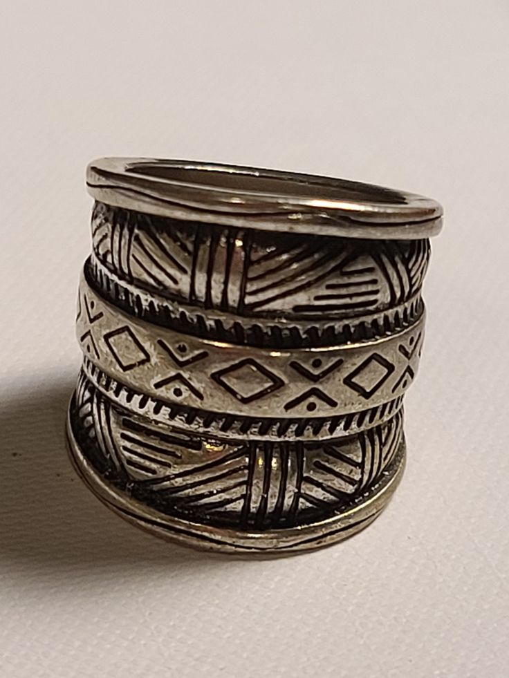 Gorgeous silver tone tribal ring. Bohemian Wide Band Ring, Bohemian Metal Stackable Rings, Bohemian Silver Metal Rings, Bohemian Silver Etched Rings, Bohemian Silver Stackable Rings, Bohemian Metal Ring With Oxidized Finish, Bohemian Ring With Oxidized Metal Finish, Bohemian Style Silver Wide Band Open Ring, Adjustable Bohemian Antique Silver Ring