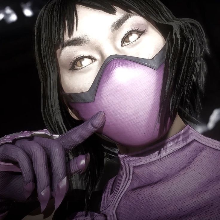 a woman with black hair wearing a purple mask and pointing her finger at the camera