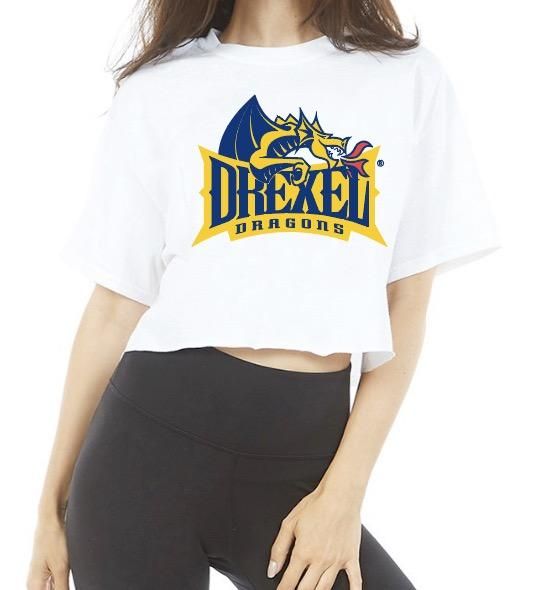 This super flattering Drexel White Cropped Tee is perfect for college game day or work from home! Our Drexel Cropped Tee's soft fabric makes it the most comfortable t-shirt to wear anytime. Go Dragons! 100% Cotton. Fits true to size. Cropped right above waist line. Modeled in a Size Small. Officially Licensed by Lo + Jo Bands. Sporty University Logo T-shirt With Crew Neck, Casual Tops With University Logo For Game Day, Sporty Crew Neck T-shirt With University Logo, Casual T-shirt With University Logo And Short Sleeves, University Logo Short Sleeve Top For Sports Season, Sporty College Tops With University Logo, University Logo Cotton Tops For Sports Season, White Short Sleeve Top With University Logo, Cotton Tops With University Logo For Sports Season