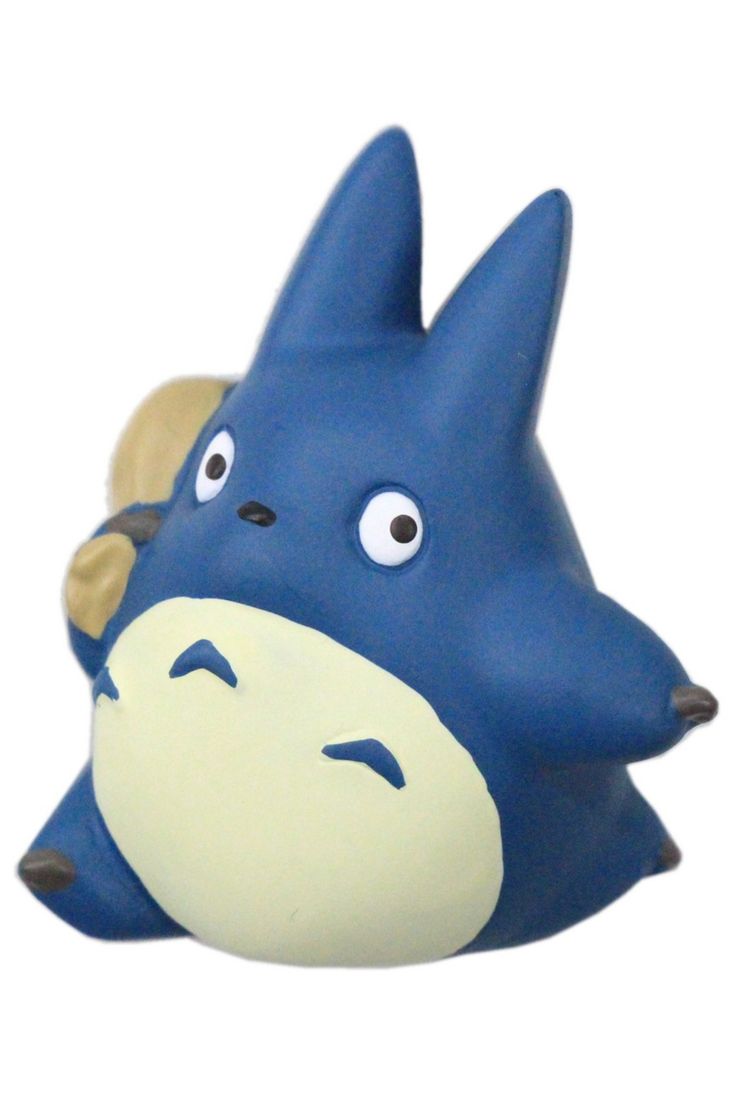 a blue and white ceramic animal with big eyes on it's head, sitting in front of a white background