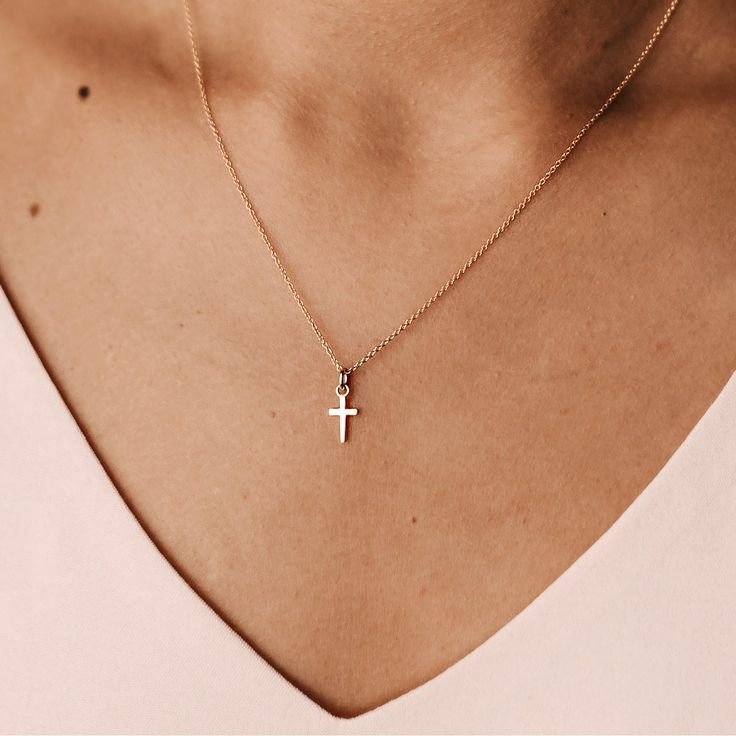 Part of our Madi Nelson x Tiny Tags Collection, our unique and delicate take on this meaningful symbol is perfect to wear alone or layered with your favorite necklace. vermeil: sterling silver base with 100+ mls of 24k gold hangs on a 14k gold filled chain cross is 9mm tall and 5.5mm wide also available in sterling silver + 14k yellow gold + pavé diamond Layered Necklaces Cross, Womens Gold Necklaces, Dainty Gold Cross Necklace, Madi Nelson, Cross Necklace Women, Tiny Tags, Favorite Necklace, Wife Jewelry, Gold Cross Necklace