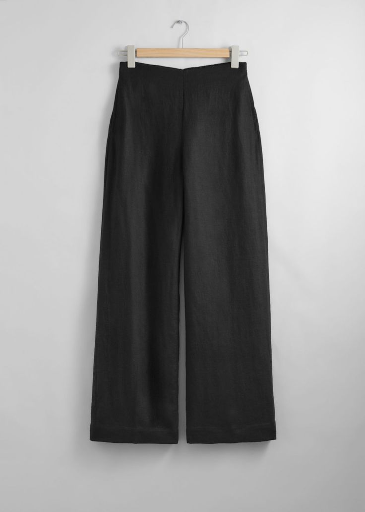 Relaxed high-waist trousers cut from a breezy material. Finished with a clean waistline.• Duo welt pockets• Zipper at the back• Length of inseam:80cm / 31.5" (EU 36 / UK 8 / US 4) Chic Linen Bottoms For Business Casual, Chic Linen Bottoms For Work, Chic Linen Workwear Bottoms, Versatile High Waist Linen Bottoms, Chic Linen Bottoms With Welt Pockets, High Waist Wide Leg Work Pants With Pull-on Style, Chic Bottoms With Wide Waistband For Work, Chic Workwear Bottoms With Wide Waistband, Wide Leg Bottoms With Wide Waistband For Work