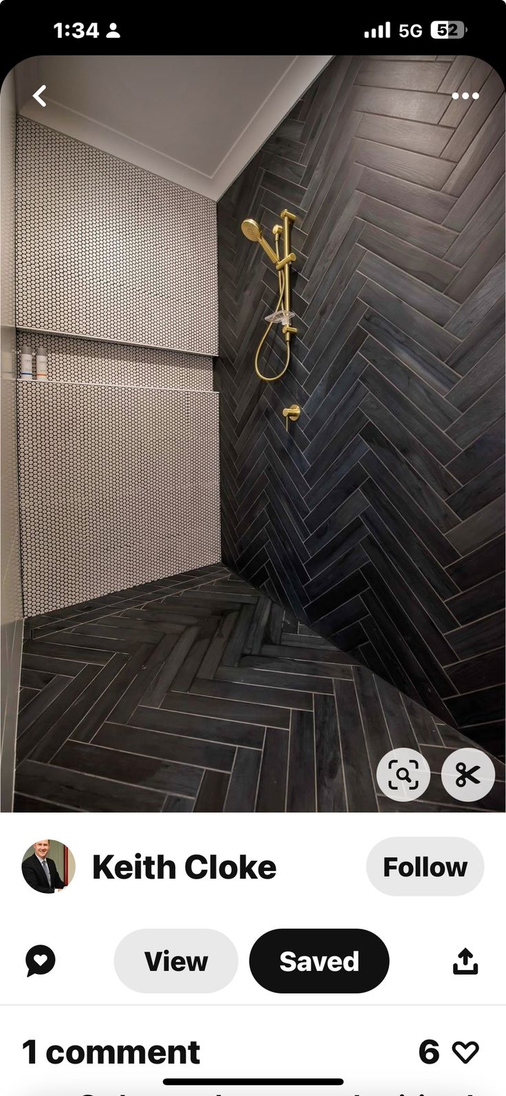 the bathroom is decorated in black and white herringbone tile, with gold shower faucet