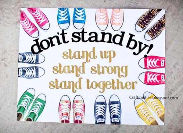 a sign that says, don't stand by stand up and sing together