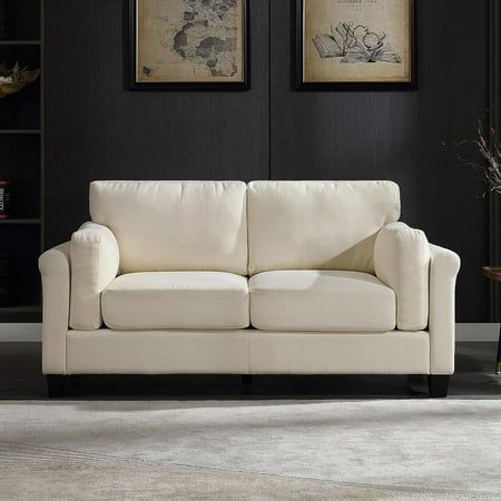 a living room with black walls and white furniture