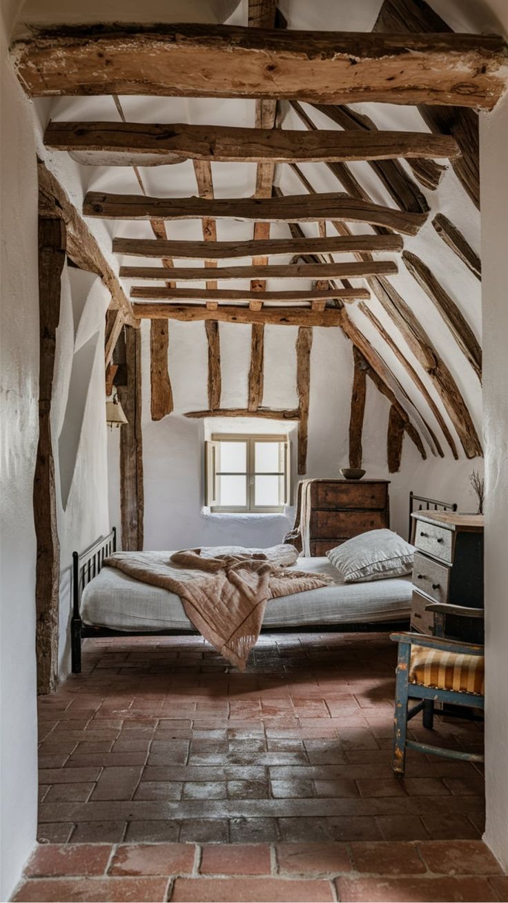 an old fashioned bedroom with exposed beams and brick flooring is pictured in this image