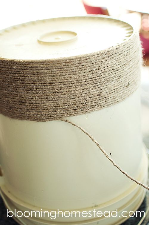 a spool of twine sitting on top of a white container