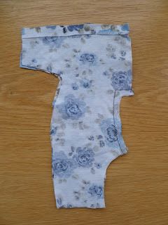 a piece of cloth that has been cut out to look like a flowered bodysuit