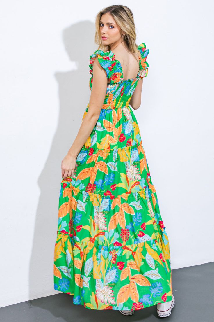 Indulge in the timeless elegance of our BEACH DATES WOVEN MAXI DRESS, adorned with a square neckline, delicate ruffled sleeves, and a smocked bodice. The tiered skirt boasts a ruffled edge, adding a touch of sophistication to this printed masterpiece.Details:Self : 100% PolyesterLining : 100% PolyesterSize & Fit- Model is 5`8" And Wearing Size Small- Measurements Taken From Size Small- Approx. Length: 53" Green Dresses With Ruffle Sleeves, Green Smocked Dress With Ruffles For Garden Party, Green Maxi Dress With Square Neck For Brunch, Green Square Neck Dress For Brunch, Beach Maxi Dress With Square Neck And Ruffle Hem, Green Square Neck Maxi Dress For Garden Party, Green Ruched Smocked Dress, Casual Green Dress With Straight Neckline, Vacation Dresses With Ruffle Hem And Square Neck