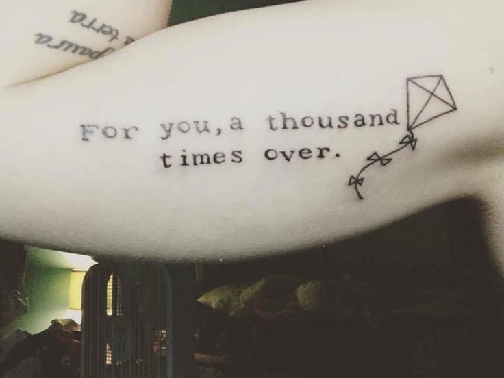 a person with a tattoo on their arm that says for you, a thousand times over