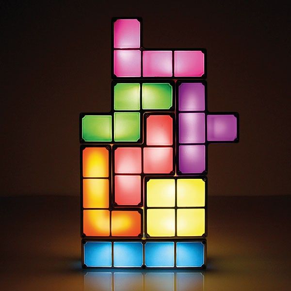 a colorful lit up block puzzle sitting on top of a table