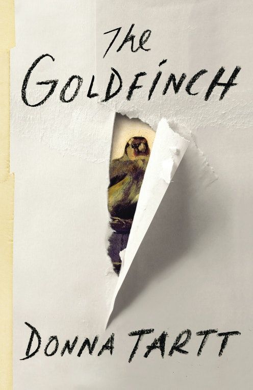 the goldfinch by donna tartti is torn in half and on top of a piece of paper