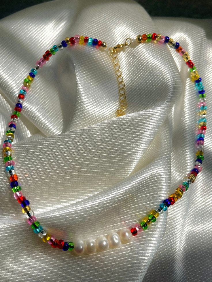 super cute rainbow beaded necklace with freshwater pearls to match your summer outfits  made with stainless steel gold  water resistant but still recommend to take good care of it to make your jewelry last longer  no refunds thank you Trendy Gold Pearl Beaded Necklaces, Trendy Gold Beaded Pearl Necklace, Trendy Beaded Choker With Pearl Chain, Trendy Pearl Jewelry With Colorful Beads, Trendy Beaded Pearl Chain Choker Necklace, Trendy Pearl Beaded Choker Necklace, Trendy Multicolor Pearl Necklace Gift, Trendy Multicolor Pearl Necklace For Gift, Trendy Multicolor Pearl Necklace