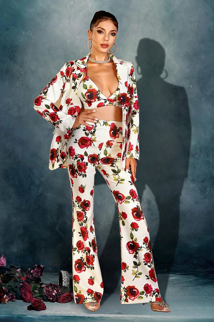 Radiate elegance in a floral pantsuit ensemble, a perfect blend of sophistication and femininity. Crafted with delicate detail to elevate your style, ideal for upscale gatherings and special occasions. Handmade customization Fabric composition: 90% polyester fiber, 10% spandex Washing method: hand wash or dry clean Popular elements: floral V-neck Party Sets For Spring, Chic V-neck Suits For Spring, Elegant Floral Print Formal Suits, Elegant Floral Print Suit For Formal Occasions, Elegant Floral Print Suits For Formal Occasions, Elegant Formal Suits With Floral Print, Elegant Two-piece Spring Suits, White Fitted Glamorous Blazer, Fitted V-neck Evening Sets