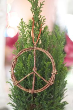 a peace sign made out of branches on top of a table