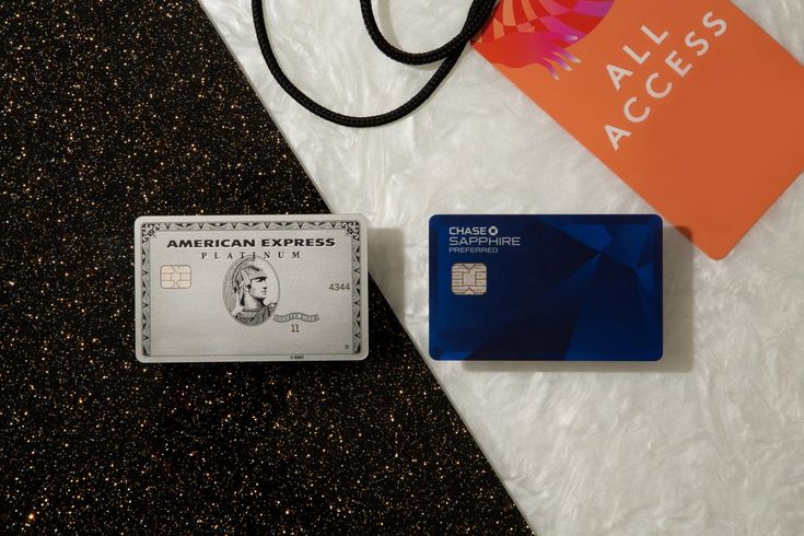 an american express credit card next to a purse