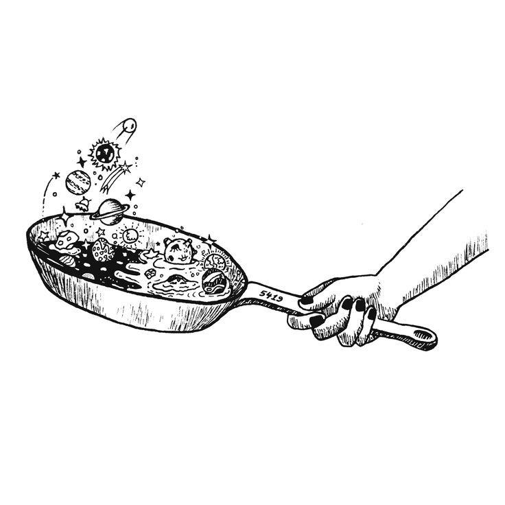 a hand holding a frying pan with food in it and sprinkles