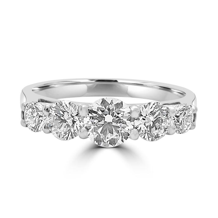 a white gold ring with five diamonds on the sides and four stones in the middle