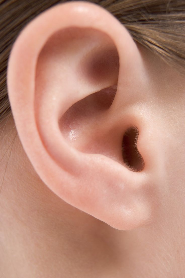 a close up view of the side of a child's ear