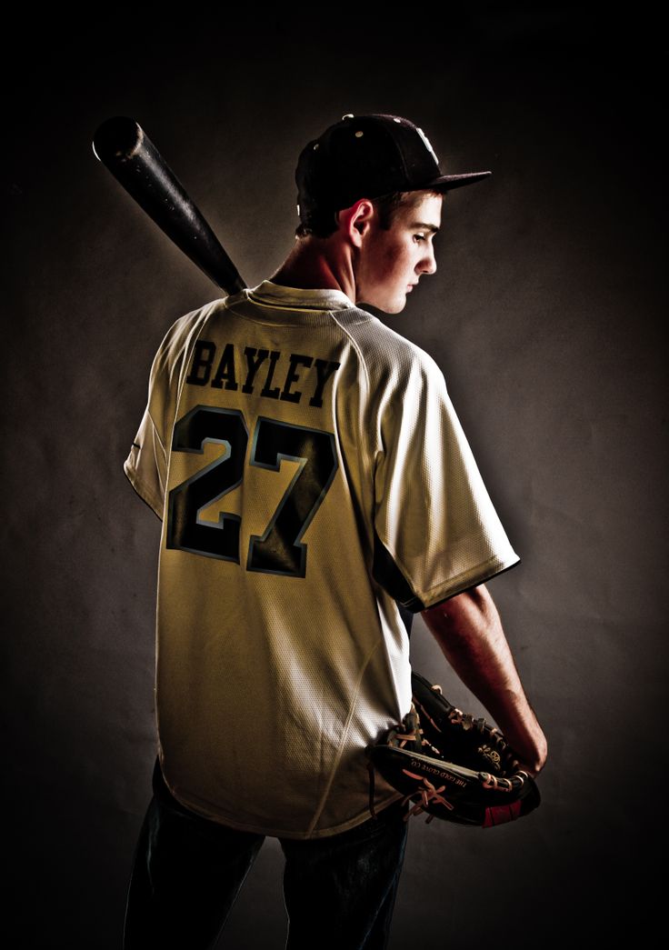 a baseball player holding a bat and wearing a number 22 jersey with the number twenty on it