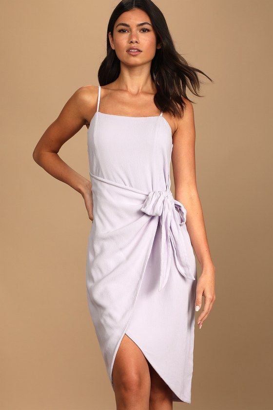 Sweltering days call for chilled wine and the Lulus Stay Sunny Lavender Faux Wrap Midi Dress! Lightweight, linen-like woven fabric shapes this perfect summer dress that boasts a straight neckline, adjustable spaghetti straps, and a relaxed silhouette that'll keep you cool when the temps really start to rise! Overlapped skirt panel ties at the side to form a faux-wrap effect above the tulip midi hem. Hidden back zipper/clasp. Fit: This garment fits true to size. Length: Knee to mid-calf length. S Summer Dress With Straight Neckline In Purple, Summer Dresses With Straight Neckline In Purple, Purple Summer Dress With Straight Neckline, Elegant Summer Mauve Midi Dress, Elegant Mauve Midi Dress For Summer, Chic Lavender Knee-length Midi Dress, Lavender Knee-length Mini Dress For Summer, Elegant Purple Mini Dress With Tie Back, Purple Midi Dress For Summer Day Out