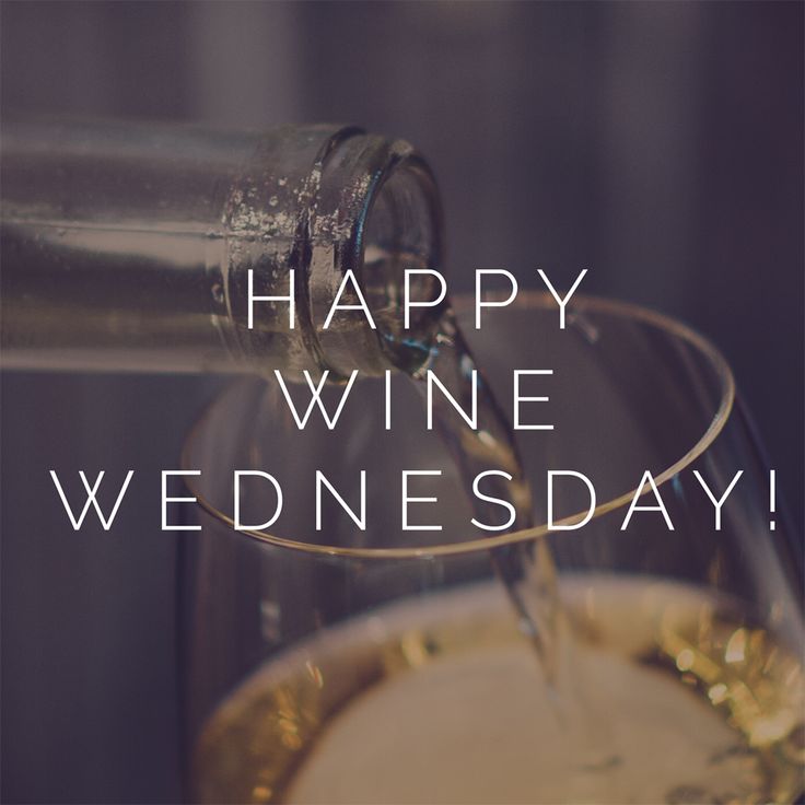 a wine glass filled with white wine being poured into it and the words happy wine wednesday