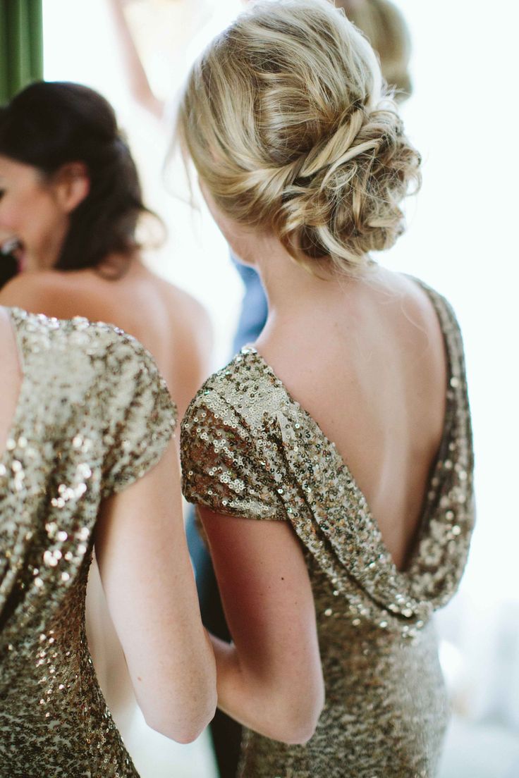 the back of a woman's dress in front of a mirror