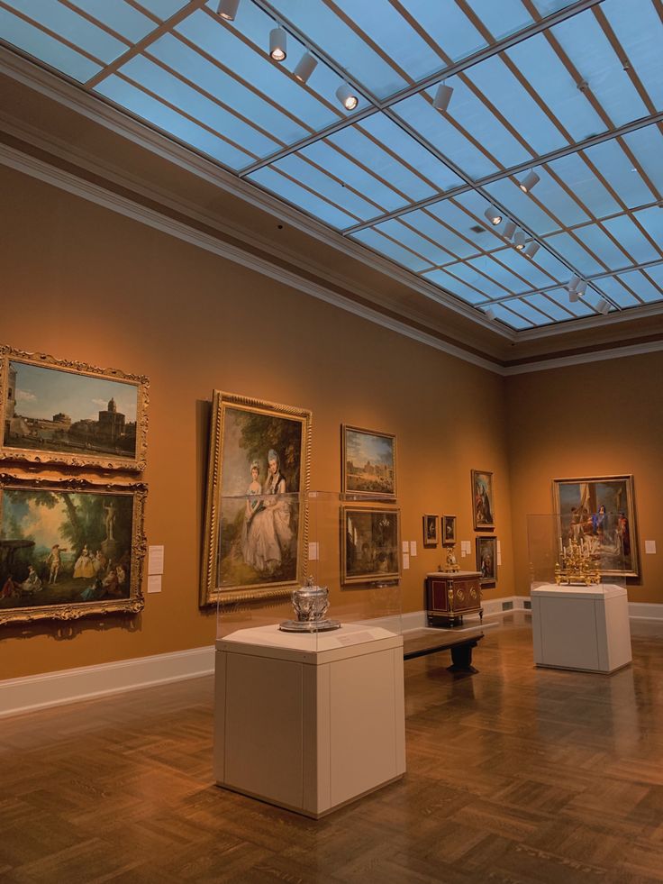 an art gallery with paintings on the walls