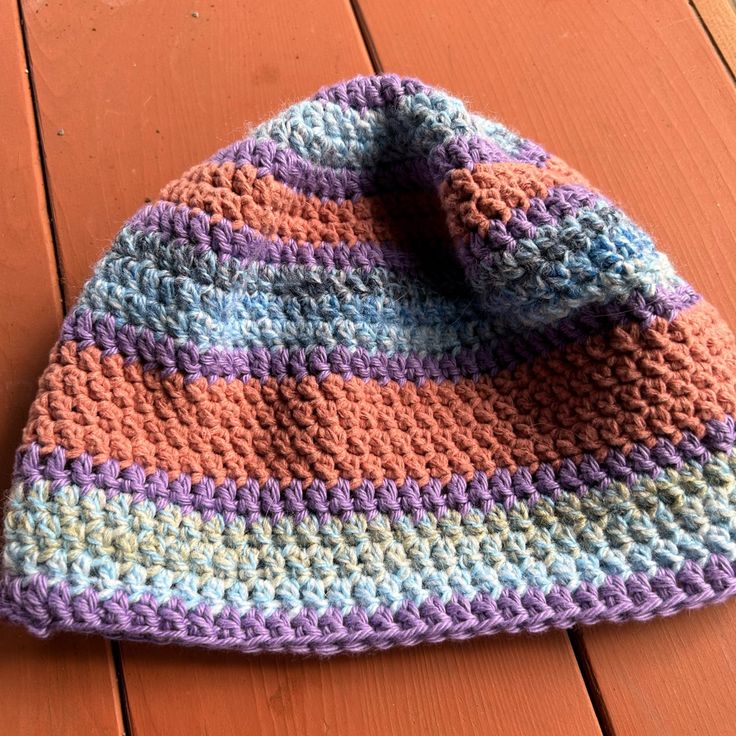 One Of A Kind Beanie Hat., Hand Crocheted. Lavender/ Blue Muted Orange Stripes Casual Purple Crochet Hat, Casual One-size Purple Crochet Hat, Casual Purple Crochet Beanie Hat, Purple Crochet Beanie For The Beach, Purple Crochet Beanie Hat For Spring, Purple Crochet Beanie For Beach, Purple Crochet Beanie For Spring, Casual Purple Brimmed Crochet Hat, One Size Purple Crochet Hat For Spring