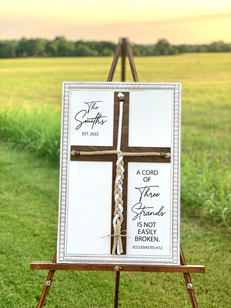 an easel with a cross painted on it