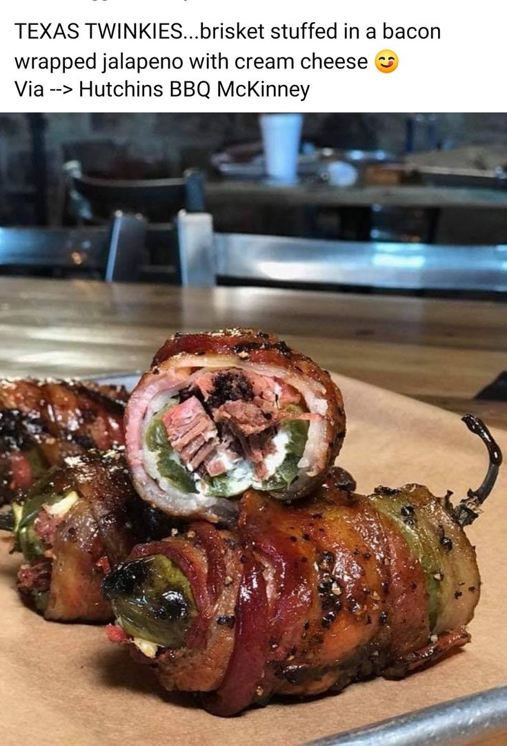 bacon wrapped jalapeno is sitting on top of a cutting board with the caption texas twinkies