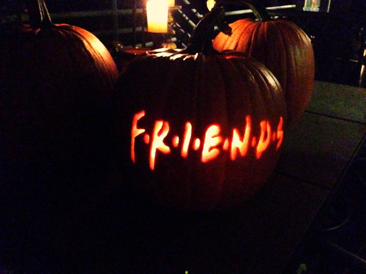 two pumpkins with the word friends carved into them