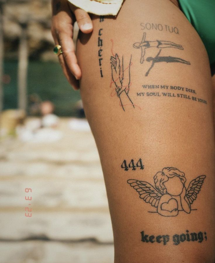 a woman's leg with tattoos on it and words written in different languages above her