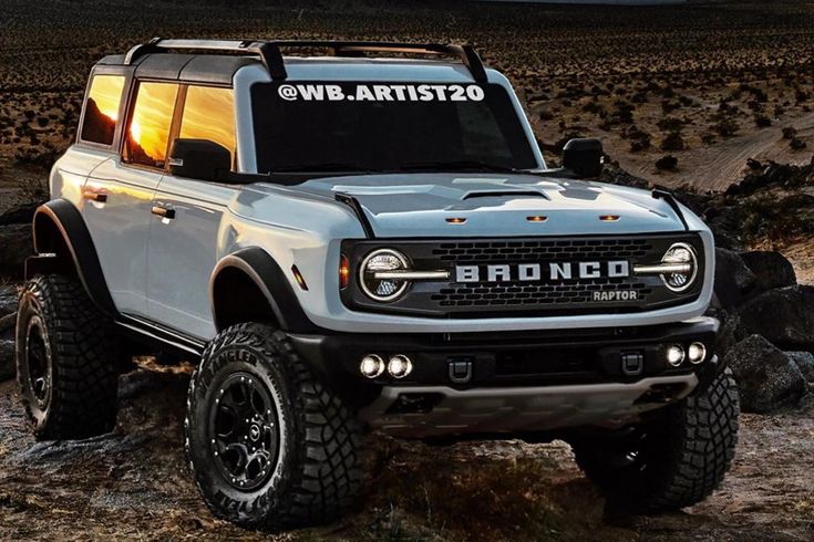 a white bronco truck parked on the side of a dirt road