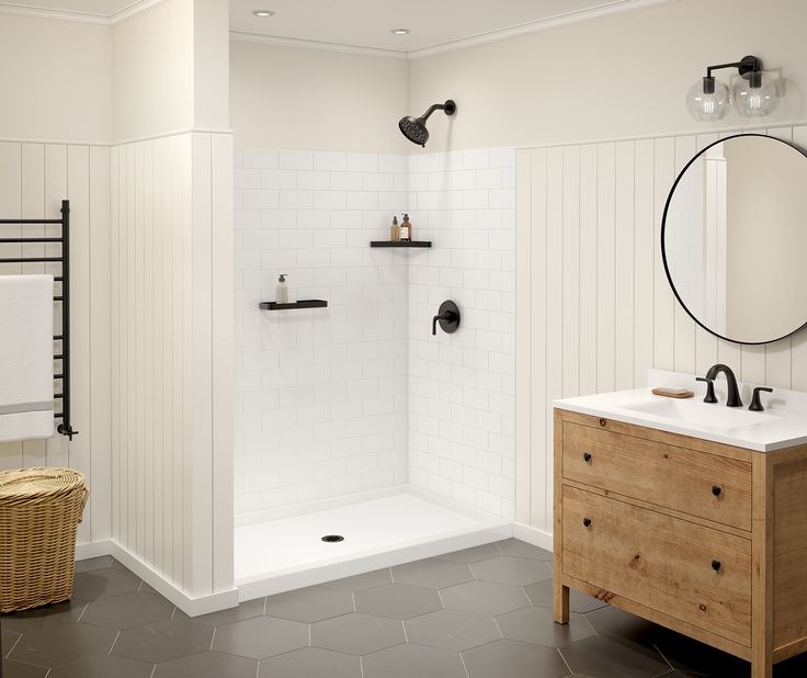 a bathroom with a sink, mirror and shower