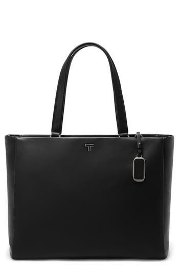 Gleaming hardware and rich leather add luxe elements to a spacious tote perfect for storing your essentials while on the go. Top zip closure Shoulder straps; removable, adjustable crossbody strap Interior zip and wall pockets This bag includes Tumi Tracer®, an exclusive, complimentary program that helps reunite lost or stolen bags with their rightful owners using a one-of-a-kind 20-digit number affixed to the bag Padded compartment fits most 15" laptops Removable pouch with carabiner clip Struct Sleek Shoulder Bag With Branded Hardware, Modern Travel Shoulder Bag With Silver-tone Hardware, Timeless Bag With Gunmetal Hardware, Tan Shoulder Bag With Palladium Hardware For Work, Versatile Travel Bag With Palladium Hardware, Sleek Rectangular Shoulder Bag With Branded Hardware, Luxury Shoulder Bag With Gunmetal Hardware For Work, Sleek Leather Bags With Metal Hardware, Sleek Leather Bag With Metal Hardware