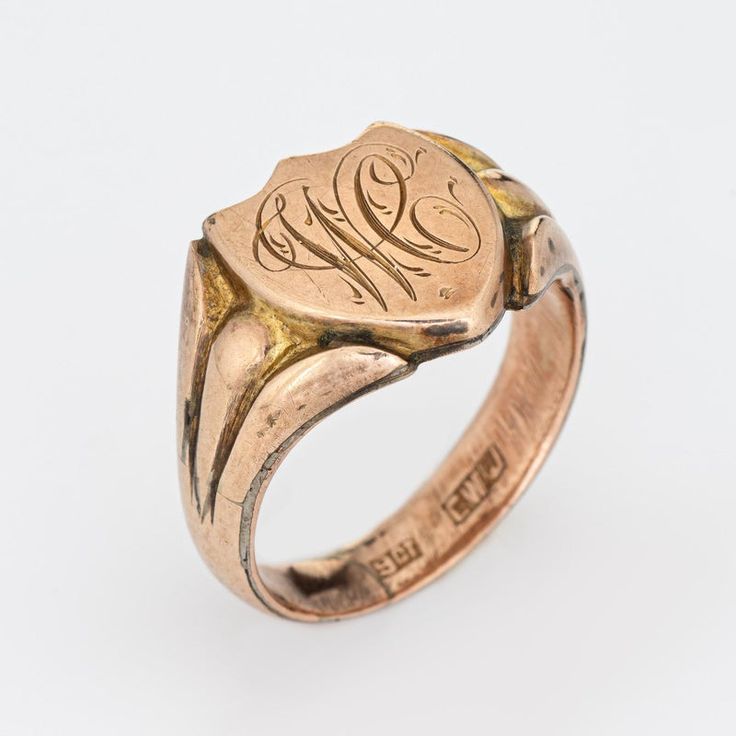 Lovely antique Victorian shield signet ring (circa 1880s to 1900s), crafted in 9 karat rose gold.   The centre shield is engraved with the initials "WC".   The side shoulders feature a pretty scrolling design that terminates to the shield mount. The saddle of the ring is low and curves to the shape of the finger.     The ring is in good condition with patina and wear evident. We have not cleaned the ring in order to preserve the patina and collector value.    Particulars:  Weight: 5.8 grammes  S Luxury 14k Rose Gold Oval Rings, Heirloom 14k Rose Gold Diamond Ring In Yellow Gold, 14k Rose Gold Round Band Ring, 14k Rose Gold Ring With Round Band, 14k Rose Gold Fine Jewelry Rings, 14k Rose Gold Round Rings Fine Jewelry, Fine Jewelry Gold Signet Ring With Gemstone, Heirloom Rose Gold 14k Rings, Fine Jewelry Engraved Open Ring