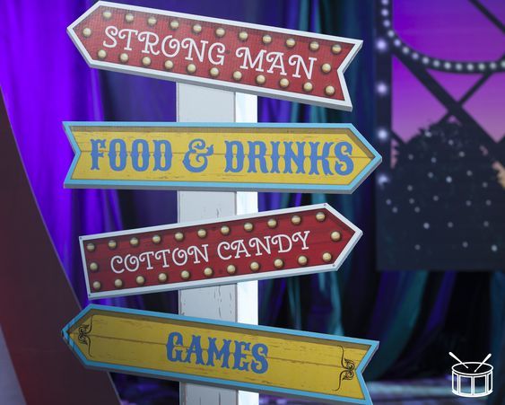 a sign that has some food and drinks on it with the words'strong man, food & drinks cotton candy games '