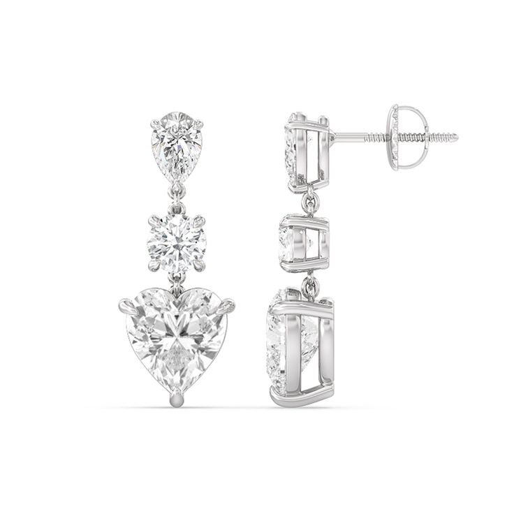 Perfect for any special day, this pair of diamond earrings is sure to give your look a dazzling finish. Each dangling earring features a trio of diamonds in pear, round, and heart shapes; together, they reflect light in an extra brilliant way. Brilliant Cut Diamond Dangle Earrings For Anniversary, Elegant Round Cut Earrings For Valentine's Day, Elegant Heart Cut Diamond Earrings With Vvs Clarity, White Gold Heart Cut Diamond Earrings, Diamond Heart Cut Earrings For Wedding, Elegant Cubic Zirconia Heart Earrings For Formal Occasions, White Gold Heart Drop Earrings For Formal Occasion, Formal Elegant Cubic Zirconia Heart Earrings, Formal White Gold Heart Drop Earrings